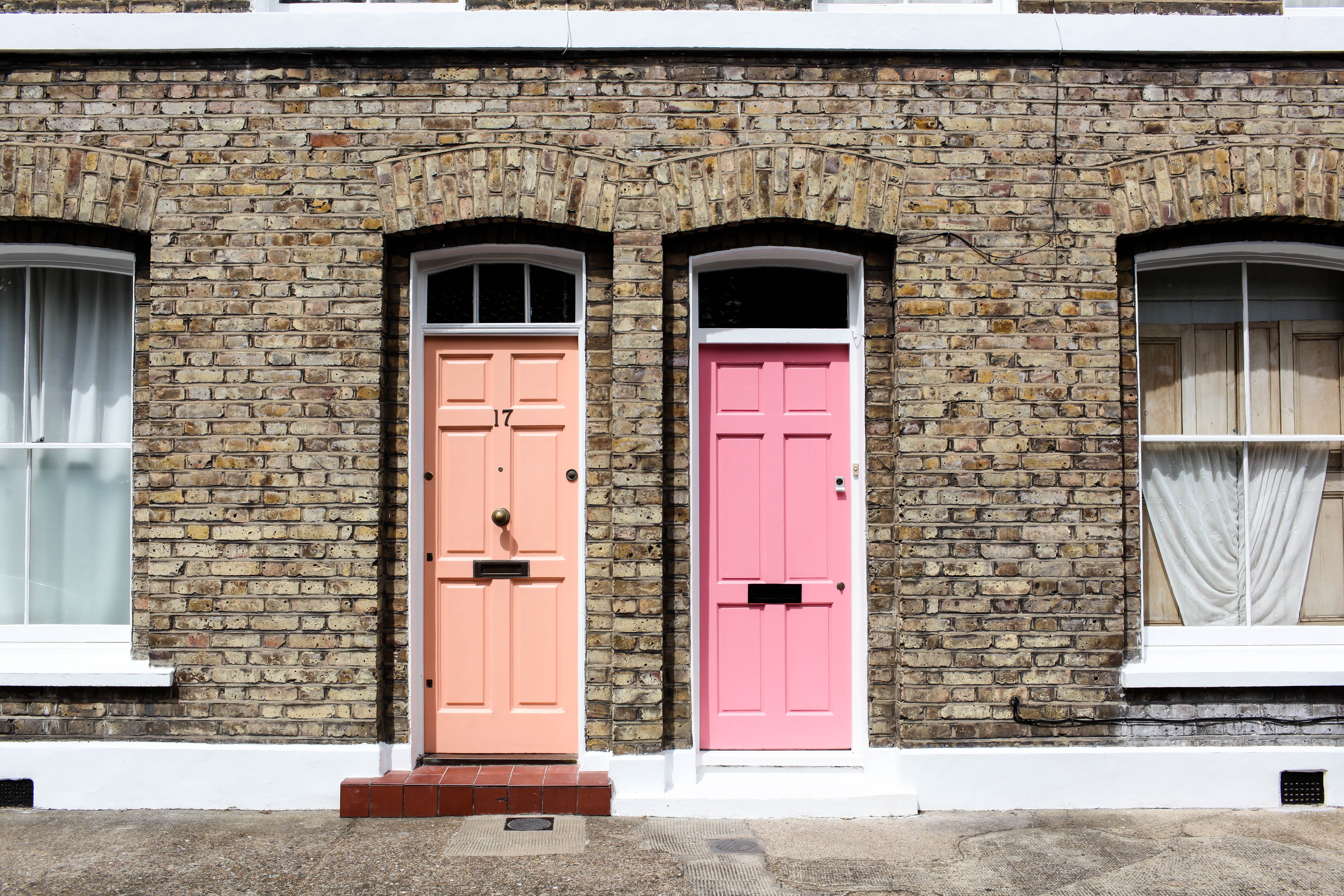 Image of terraced houses with pink door and red door